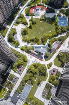 an aerial view of a park in the middle of some buildings