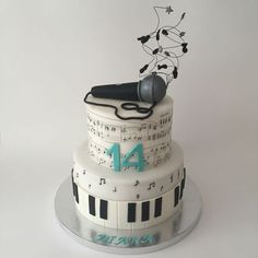 a cake decorated with musical notes and a microphone