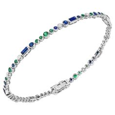 Bracelet White Gold 14K Weight - 6,22 grams Size 18 cm Diamond 11-RND 57-0,33 ct Blue Sapphire 6-0,94 ct Blue Sapphire 23-1,35 ct Emerald 22--0,71 ct With a heritage of ancient fine Swiss jewelry traditions, NATKINA is a Geneva-based jewelry brand that creates modern jewelry masterpieces suitable for everyday life. It is our honor to create fine jewelry, and it’s for that reason that we choose to only work with high-quality, enduring materials that can almost immediately turn into family heirlooms. From our selection of precious metals set with genuine precious stones, you can rest assured that NATKINA is jewelry for your everyday life forever. Luxury Sapphire Tennis Bracelet For Women, White Gold Multi-stone Round Bracelet, Elegant Blue Multi-stone Bracelets, Elegant Blue Multi-stone Bracelet, Emerald Blue, Gems Bracelet, Emerald Bracelet, Modern Bracelets, Blue Sapphire Diamond