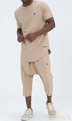 QL Relaxed Fit Nautik Set in Beige Description:Enjoy the warmth of summer with a fresh new look! This T-shirt and shorts set offers comfort, functionality and style. Featuring a shirt with a round neck and a stylish round hem and a three-quarter shorts that lets you enjoy the sun while keeping covered. This holiday wardrobe is all you need to feel at your best this season. Modern Islamic clothing for men Very high-quality fabric from top brands Short sleeved T-shirt with a small logo on the left Summer Cotton Sets With Built-in Shorts, Beige Leisure Shorts For Summer, Short T-shirt For Summer Loungewear, Sporty Beige Tops For Summer, Casual Sets With Built-in Shorts, Casual Sets With Built-in Shorts And Short Sleeve, Casual Khaki T-shirt For Summer, Casual Short Sleeve Sets For Summer, Beige Stretch Casual Shorts