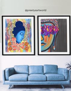 two paintings are hanging on the wall next to a blue couch in a living room