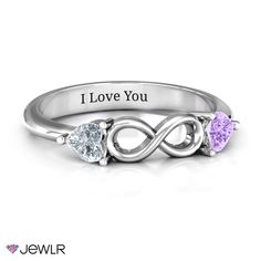 three stone heart shaped ring with the words i love you on it and two hearts