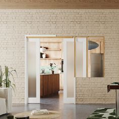 a living room filled with furniture and a brick wall