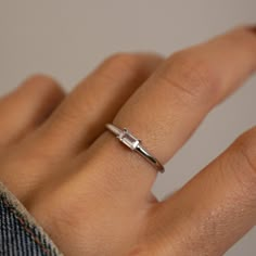 Beautiful baguette ring that is great for stacking or worn alone! It's simple, yet stunning!! Made of 925 Sterling Silver We use a THICK plating of 14k Gold or Rhodium Available in sizes 4-10 Nickel-free & Hypoallergenic 3x5mm Baguette Stone Made of highest grade cubic zirconia for an authentic diamond look! Rings Engagement Silver Simple, Sterling Silver Engagement Rings Simple, Silver Minimalist Engagement Ring, Baguette Stone Ring, Silver Baguette Ring, Minimalist Emerald Cut Rings For Everyday, Minimalist Everyday Emerald Cut Rings, Minimalist Everyday Stackable Rings With Baguette Cut, Everyday Minimalist Stackable Rings With Baguette Cut