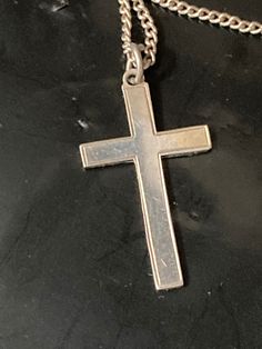 925 Sterling silver plain religious cross pendant necklace on chain Pendant height 4 cm   Total Weight 4 grams  Chain length  45 cm   All my silver is hallmarked /stamped and unpolished ... it will come with a silver polishing cloth. If you would like it dip cleaned before posting please let me know in the message section.  This is my sole small business .. I post daily and combine postage. All purchases come with full Etsy cover .. I am an established Etsy star seller and have sold over 20,000 items with 5 star reviews so please buy with confidence and ask any questions   Kind regards and thanks for looking  yours nostalgically Karen at LaLa ( loved and loved again ) xx Silver Crucifix Necklace With Polished Finish, Hallmarked Silver Cross Necklace, Silver Hallmarked Cross Necklace, Silver Engraved Cross Pendant Necklace, Silver Cross Necklace Stamped 925, Silver 925 Stamped Cross Necklace, Silver 925 Stamped Cross Pendant Necklace, Hallmarked Silver Cross Pendant, Silver Hallmarked Cross Pendant