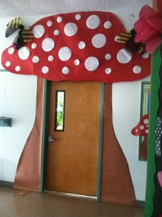 the door is decorated like a mushroom house