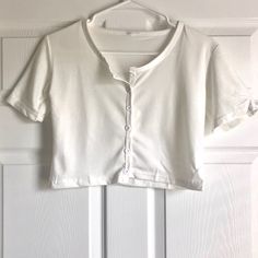 White/Cream Button Crop Top Nwot Buttons Are Unaligned And Asymmetrical (Photos Included) Size: One Size But Fits Like A X-Small Measurements: Length- 15.75 Inches Sleeve Length- 11 Inches Sleeve Opening- 5 Inches Bust/Pit To Pit- 15.75 Inches Open To Offers! Button Crop Top, White Cream, Cream White, 11 Inches, Crop Top, Womens Tops, Sleeve Length, Crop Tops, Cream