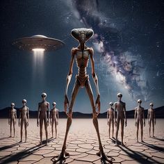 an alien standing in the middle of a desert with many other humanoids around him