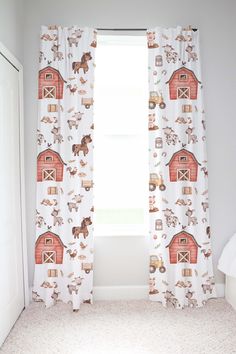 the curtains in this room are decorated with farm animals