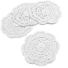 three white crocheted coasters on a white background