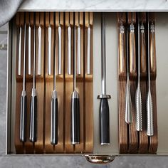 the kitchen utensils are neatly organized and ready to be put into the oven