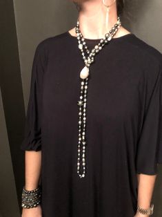 132 South Sea, Tahitian, and Akoya pearls are hand-knotted on silk. A rare “cake-pop” Baroque pearl hangs central to this necklace. Can be worn long, doubled, or three times around the neck. No clasp. 66" with 1.5" drop. Luxury Long Pearl Necklace With Charm, Luxury Lariat Pearl Drop Necklace, Luxury Pearl Lariat Necklace, Elegant Hand Knotted Lariat Jewelry, Long Single Strand Pearl Necklace For Party, Luxury Lariat Pearl Necklace With Pendant, Pearl Lariat Necklace With Beaded Pearl Chain, Adjustable Double Strand Pearl Drop Necklace, Elegant Double Strand Beaded Necklace With Pearl Drop