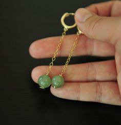 "I've always been passionate about the combination leveraging traditional Asian jewelry materials. Light weighted hoop earrings in high quality green jade. Classical and great for daily wear. Enjoy About this Earrings: Condition: Brand new Earring wire: 925 silver Materials: Icy nephrite jade Color : Green Approximate jade diameter: 8MM, 0.31\" Approximate Hoop Earring size: 13MM, 0.51\" Jade earring length: 62MM, 2.4\"" Green Dainty Huggie Jewelry, Dainty Green Huggie Jewelry, Handmade Hoop Jade Jewelry, Handmade Jade Hoop Jewelry, Gold Jade Hoop Jewelry, Green 14k Gold-filled Dangle Earrings, Green 14k Gold Filled Dangle Earrings, Hypoallergenic Gold Plated Green Jewelry, Hypoallergenic Green Gold-plated Jewelry