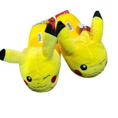 a pair of yellow slippers with pikachu on them