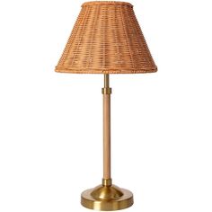 a wicker lamp on a gold base with a light shade in the middle and a white background