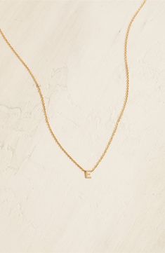 Personalize your stack with this layering-friendly necklace centered with a dainty pendant of your favorite initial filled with 14-karat yellow gold. 16" length 14k-gold fill Made in the USA Everyday Yellow Gold Initial Necklace, Everyday Yellow Gold Initial Necklace With Delicate Chain, Dainty 14k Gold Filled Initial Necklace For Everyday, Tiny Gold Initial Necklace For Everyday, Everyday Tiny Gold Initial Necklace, Dainty Initial Pendant Necklace For Layering, Dainty 14k Yellow Gold Filled Initial Necklace, E Necklace, Dainty Pendant