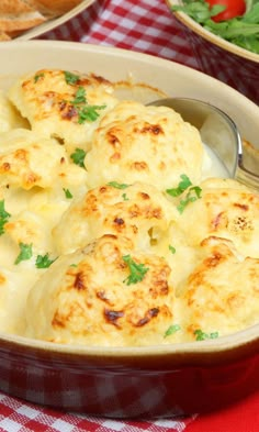 a casserole dish filled with cheese and garnished with parsley