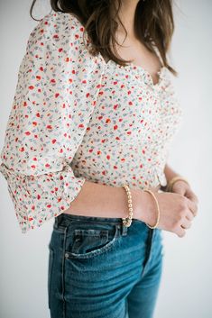 Our Parker floral top brings the ultimate femme vibes to your outfit. This beautiful top has is ruched in the front and has smocking in the back. It has a scoop neckline and can be worn both on and off the shoulder. The flowly sleeves add extra elegance to this simple top. With multiple ways to wear and style this top it is sure to be a go to. Size Chart Features: scoop neckline smocking in the back puff sleeve ruched front detail model is wearing a small. Height 5'7", Bust 34", Waist 25", Hip 3 Simple Top, Denim Accessories, Dress Romper, Floral Top, Scoop Neckline, Bottoms Pants, Short Tops, Smocking, Puff Sleeve