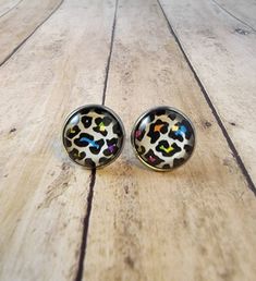 These stainless steel stud earrings are approximately 12mm in diameter. Trendy Leopard Print Earrings As Gift, Trendy Silver Stud Jewelry, Trendy Round Plug Earrings For Gifts, Trendy Round Plug Earrings As Gift, Adjustable Leopard Print Earrings For Gift, Trendy Metal Stud Jewelry, Leopard Print Earrings For Pierced Ears As Gift, Metal Studs Jewelry For Gifts, Leopard Print Drop Earrings Gift