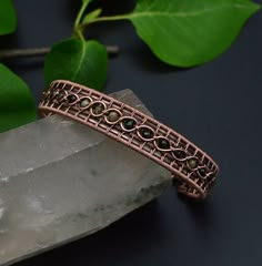 "There is nothing like a good cuff bracelet! Its feeling of indestructibility makes it a powerful, fashion accessory. 🌈 The bracelet is handcrafted by hand, antiqued with jewelry patina finish to enhance the work detail, hammered for more strength and polished by hand. Wire wrapped in Multi-Colored Tourmaline 0.4 mm beads,  a variety of tourmaline containing two or more colors displayed in one crystal. ... With colors ranging from green to  black. Tourmaline is a powerful grounding stone, elect Mens Copper Bracelet, Wire Jewelry Patterns, Wire Wrapped Jewelry Diy, Bijoux Fil Aluminium, Copper Cuff Bracelet, Wire Jewelry Designs, Tourmaline Bracelet, Wire Wrapped Bracelet, Copper Cuff