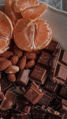 an assortment of chocolates, nuts and orange slices