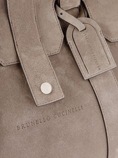 Brunello Cucinelli's weekend bag is an ideal companion for travel, whether you're heading out for business or a relaxing getaway. It’s made from soft suede and is roomy enough for a spare pair of shoes, a change of clothes and a book. Luxury Shoulder Bag With Suede Lining, Luxury Suede Shoulder Bag, Elegant Suede Satchel For Travel, Luxury Suede Shoulder Bag With Top Handle, Luxury Suede Shoulder Bag With Top Carry Handle, Luxury Everyday Suede Bags, Designer Suede Bag With Suede Lining, Luxury Tote Bag With Suede Lining, Luxury Suede-lined Tote Bag