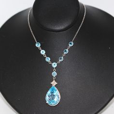 ⚓14k White Gold Pear Shaped Blue Topaz Lariat Necklace with Accented Topaz Chain Solid white gold, stamped 14k. Not filled, hollow or plated.  We sell the highest quality vintage items. Like-new condition! Free domestic shipping always! On its way to you in 1 business day.  30 day return policy!  ⚓The Details 8 round Blue Topaz Pear Shaped Blue Topaz approximate 7 ct wt 4.8 grams 16 inch chain ⚓Who We Are  We are a small, family-owned business in Plymouth, MA. Located in the heart of Main Street, Main Street Jewelry Co.'s mission is to find one-of-a-kind, unique pieces. Vintage, antiques, and rare finds are our specialty, of course other than our brand new Italian silver chains with a price that can't be beat. We thank you for supporting small businesses everywhere and checking out our sho Formal Blue Topaz Teardrop Pendant Necklace, Blue Topaz Teardrop Necklace For Formal Occasions, Formal Blue Topaz Teardrop Necklace, Formal Teardrop Blue Topaz Necklace, Formal Blue Topaz Briolette Necklace, Formal Blue Topaz Drop Necklace, Elegant Blue Sterling Silver Lariat Necklace, Street Jewelry, Silver Chains