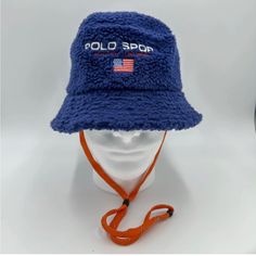 Polo Ralph Lauren Men’s Polo Sport Logo Fleece Bucket Hat Blue Size S/M Come With String But Can Be Taken Off Easily.Unisex Casual Hats With Fleece Lining And Curved Brim, Casual Hat With Fleece Lining And Curved Brim, Blue Flat Brim Bucket Hat One Size, Casual Fleece-lined Hat With Curved Brim, Blue Flat Brim Bucket Hat, Casual Curved Brim Hat With Fleece Lining, Blue Winter Outdoor Hat, Casual Hats With Fleece Lining For Outdoor Activities, Navy Bucket Hat With Short Brim