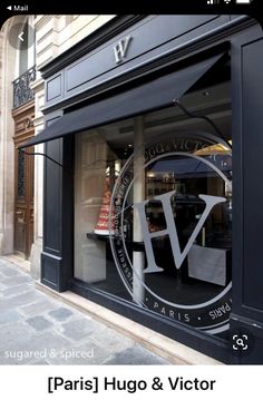 a store front window with the word v on it