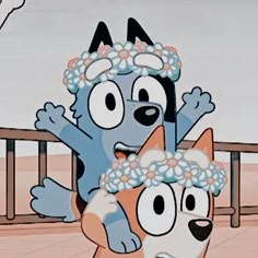 two cartoon characters are hugging each other in front of a fence with flowers on their heads