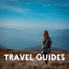 a woman standing on top of a grass covered hillside with the words travel guides above her