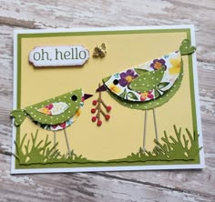 a close up of a greeting card with two birds on each side and the words oh hello