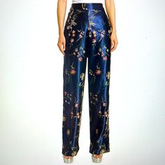 Floral Garden Embroidered Satin Pants Banded Waist Front Elasticized Waist Back Pull On Style Side Seam Pockets Silk Floral Print Straight Pants, Silk Floral Print Long Bottoms, Silk Floral Print Long Pants, Silk Floral Straight Pants, Silk Long Pants With Floral Print, Silk Straight Pants With Floral Print, Silk Wide-leg Pants With Floral Print, Elegant Silk Pants With Floral Print, Floral Print Pants For Spring Festivals