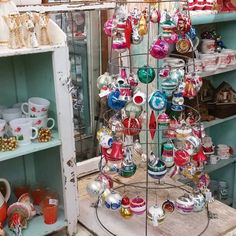 a display case filled with lots of glass ornaments