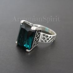 Searching for ring made of sterling silver 925 and rectangle teal stone? Pay attention to this ring. This ring is made with a tall stone in the shape of a rectangle. The stone has a rare and unusual color. It will suit the dress, coat, scarf of teal color. FREE shipping Worldwide (tracked) We make the same set with different stone colors: teal, purple and dark burgundy. Ring: Sterling silver 925, zircon Weight: 10 grams Dimensions of the stone approximately: 0.8 inchX0.5 inch = 1.5 cmX1 cm Earri Sterling Silver Green Jewelry With Jewels, Green Sterling Silver Jewelry With Jewels, Stamped 925 Emerald Jewelry, Sterling Silver Rings With Jewels For Gifts, Emerald Jewelry With Stone Setting For Gift, Green Sterling Silver Jewelry With Stone Setting, Elegant Hallmarked Turquoise Jewelry, Elegant Turquoise Sterling Silver Jewelry, Formal Turquoise Jewelry Hallmarked