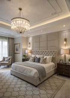 a bedroom with a large bed, chandelier and two lamps on the ceiling