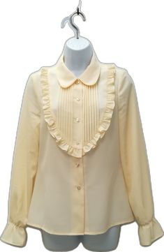 Classic Beige Shirt For Daywear, Classic Shirt With Ruffled Collar For Office, Classic Shirt With Ruffled Collar For Work, Classic Office Shirt With Ruffled Collar, Classic Long Sleeve Shirt With Ruffles, Chic Cream Formal Shirt, Classic Ruffled Shirt For Office, Chic Cream Collared Shirt, Formal Shirt With Ruffles