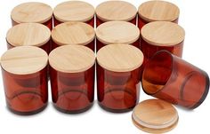 a set of twelve wooden jars with lids and wood discs on the bottom one is empty