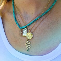 Turquoise is called the self acceptance stone. It promoted self-esteem and unconditional love. Our hand beaded necklace also has a Hamsa charm pendant in goldtone plated brass with cubic zirconia stones. The Hamsa symbol dates back to ancient Mesopotamia where the open right hand is seen in artifacts and in the amulets of the goddess Ishtar. Other symbols of divine protection based around the hand include the Hand-of-Venus which was used to protect women from the evil eye and/or boost fertility, Turquoise Square Pendant Necklace For Jewelry Making, Turquoise Gemstone Beads Pendant Jewelry, Turquoise Charm Necklace For Gifts, Turquoise Charm Necklace For Gift, Spiritual Turquoise Charms Necklaces, Turquoise Charms Jewelry For Gift, Turquoise Pendant Necklace For Healing, Turquoise Pendant Jewelry With Charms, Handmade Turquoise Spiritual Charm Necklaces