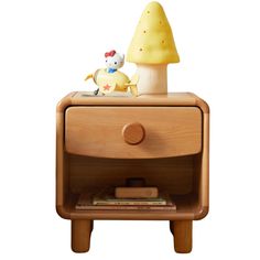 a wooden night stand with an animal figurine sitting on it's side