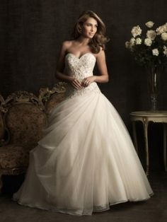 a woman in a wedding dress posing for the camera