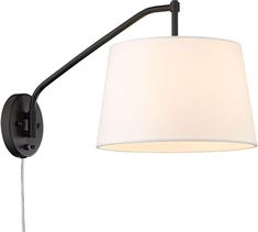 a black wall light with a white shade on the side and a metal pole attached to it