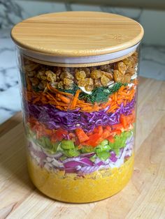 a glass jar filled with different types of food