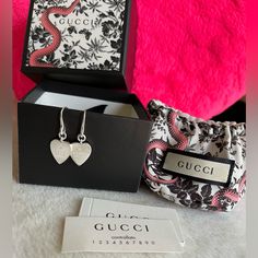 Gucci Heart Silver Dangling Earrings Super Pretty Comes With Box And Dust Bag Gucci Sterling Silver Earrings For Formal Occasions, Luxury Heart Charm Earrings For Valentine's Day, Luxury Earrings With Heart Charm, Gucci White Gold Sterling Silver Earrings, Gucci White Gold Jewelry For Gift, White Gold Gucci Jewelry For Gift, Luxury Sterling Silver Heart Cut Earrings, Luxury Heart Cut Earrings For Gift, Luxury Heart Cut Earrings As A Gift