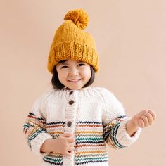 It's never too early to set your own style. Soft as can be, this pom hat will keep your little one's head warm and cozy. Whether they're taking their first steps or just rocking life, this Classic Pom hat is a must-have accessory.Crafted with care using 100% Hand-knit Acrylic. All measurements laid flat, unstretched. If unsure, size up.SIZE CHART: Extra Small 3-6 months: 14cm W x 15cm HSmall 6-24 months: 15cm W x 17cm HMedium 2-5 years: 16cm W x 19cm H Stripe Cardigan, Baby Knitwear, Retro Rainbow, Cotton Gifts, Little Golden Books, Baby Cardigan, Pom Pom Hat, Retro Color, Striped Cardigan