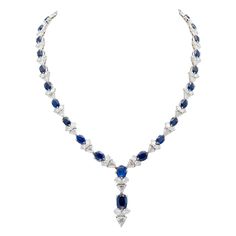 Finely crafted in 18K white gold featuring pear- and trillion-cut diamonds weighing a total of approximately 26.00 carats and oval cushion-cut sapphires weighing a total of approximately 32.00 carats. Circa 1960s-70s. Long Diamond Earrings, Gold Drop Necklace, Diamond Drop Necklace, Necklace Emerald, The Bling Ring, Blue Sapphire Necklace, Soul Contract, Diamond Necklace Designs, Boot Jewelry