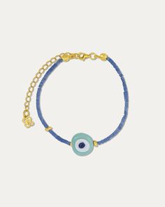 Embrace the protective and stylish energy of the Solana Evil Eye Blue Beaded Bracelet. This charming bracelet showcases a captivating evil eye charm surrounded by beautiful blue beads. The evil eye symbol is believed to ward off negativity and bring good fortune, making this bracelet not only a stack favourite but also Evil Eye Jewellery, Evil Eye Blue, Charming Bracelet, Evil Eye Symbol, Negative Vibes, Hand Evil Eye, Handmade Evil Eye, Evil Eye Design, Eye Symbol