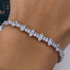 6.10 Carat Diamond Tennis Bracelet, Marquise Cut Lab Grown Diamond Pave Set Bracelet, 14k White Gold Bracelet for Her ✤ Center Stone Details:   - 𝐂𝐮𝐬𝐭𝐨𝐦𝐢𝐳𝐞: Yes - 𝐂𝐡𝐚𝐢𝐧/ 𝐍𝐞𝐜𝐤𝐥𝐚𝐜𝐞 𝐓𝐡𝐢𝐜𝐤𝐧𝐞𝐬𝐬:  - 𝐌𝐞𝐭𝐚𝐥: 925 Silver / 10K Gold / 14k Gold - 𝐒𝐭𝐨𝐧𝐞: Lab Grown Diamond - 𝐂𝐥𝐚𝐫𝐢𝐭𝐲: VVS - 𝐂𝐨𝐥𝐨𝐫: D-E-F - 𝐂𝐮𝐭: Very Good - 𝐏𝐨𝐥𝐢𝐬𝐡: Excellent - 𝐂𝐨𝐧𝐝𝐢𝐭𝐢𝐨𝐧: New ↦ Making Process: Handmade - Crafted by our experienced team Diamond Shape : Marquise Cut  Diamond Total Weight: 6.10cts + Metal Weight: 13.30 grams Each Diamond Weight: .35ct -.40ct. each Diamond Color: DEF Diamond Clarity: VS+ ➥ Metal Metal:  Silver / Gold Yellow gold ( 10kt / 14kt) Rose gold ( 10kt / 14kt) White Gold ( 10kt / 14kt) ✤𝐏𝐫𝐨𝐝𝐮𝐜𝐭𝐢𝐨𝐧   - All items are made to Luxury Diamond White Diamond Cut Chain Bracelet, Luxury Lab-grown Diamond Engagement Bracelet, Graff Tennis Bracelet, Luxury Marquise Diamond Bracelet For Anniversary, Luxury Wedding Diamond Bracelet With Marquise Cut, Luxury Marquise Tennis Bracelet With Prong Setting, Luxury Marquise Cut Bracelets For Anniversary, Luxury Marquise Cut Diamond Bracelet For Formal Occasions, Luxury Marquise Cut Diamond Bracelet For Formal Events