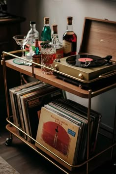 record player bar cart with vinyl albums and liquor