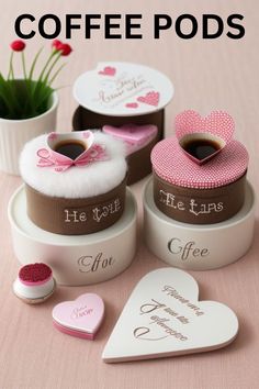 coffee pods are sitting on a table with hearts